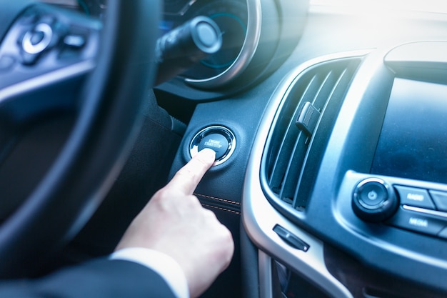 Free photo press the start button of the car to start the vehicle