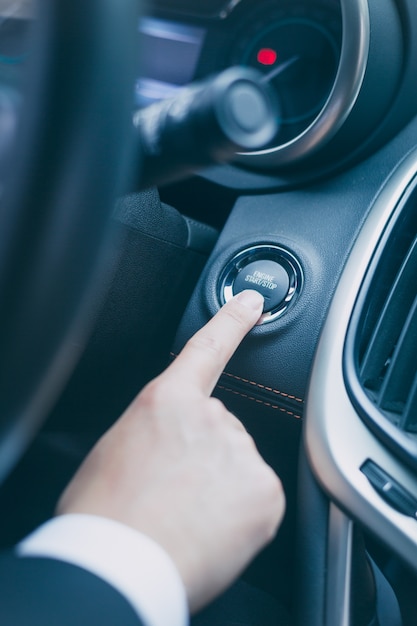 Free Photo press the start button of the car to start the vehicle