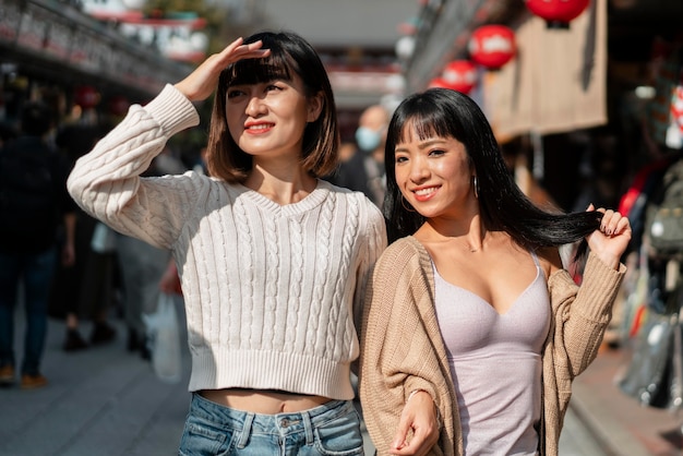 Pretty asian girls laughing together