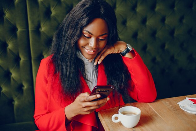 pretty black girl in a cafe