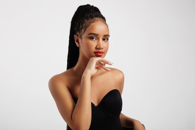 Free photo pretty black woman's portrait wears braids in pony tail