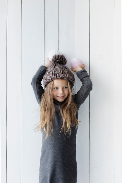 Free Photo pretty blonde girl holding snowballs