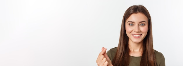 Pretty caucaisan female teenager standing and smiling over white background