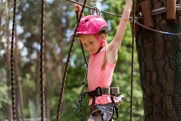 Free photo pretty girl having fun at an adventure park