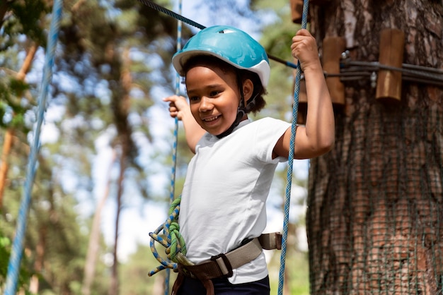 Pretty girl having fun at an adventure park