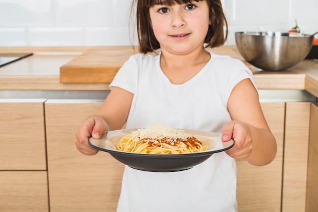 Pretty girl holding plate