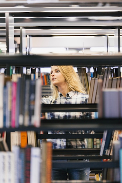 Pretty girl picking books