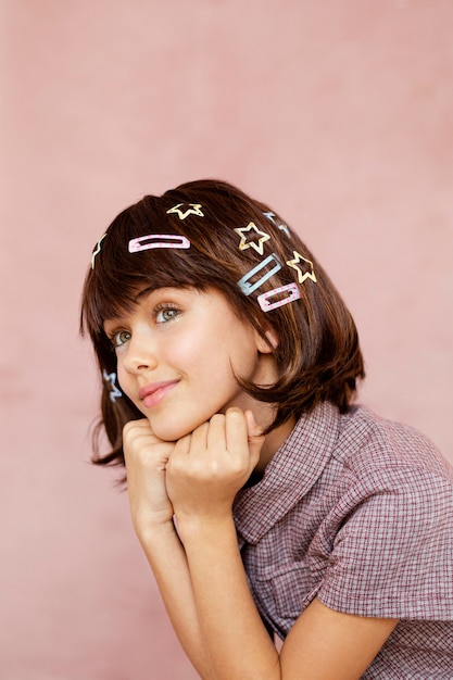 Free photo pretty girl with hair clips