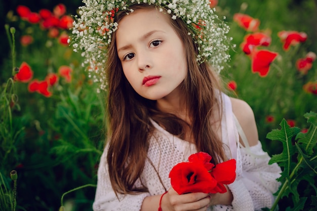 Pretty girl with red flowers