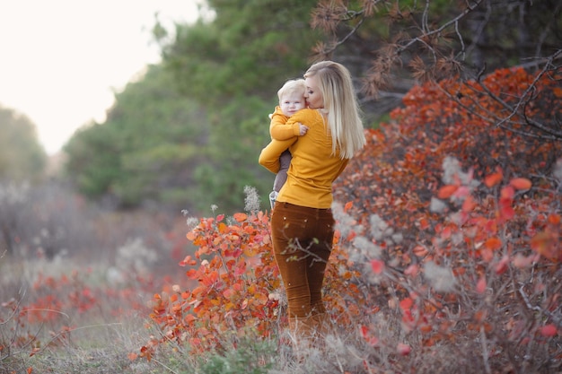 Free Photo pretty mom and baby outdoor