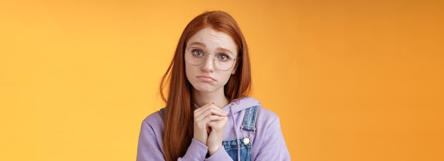 Pretty please clingy young sad sulking redhead girl sibling wearing glasses pouting silly press palm