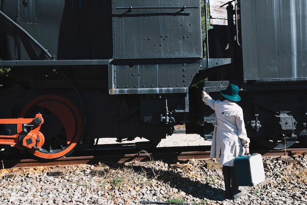 Free Photo pretty woman climbing on train