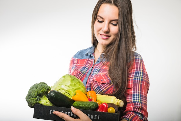 Pretty woman looking at vegetables