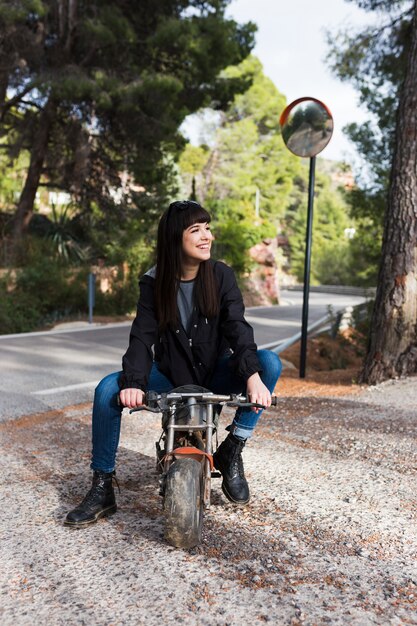 Pretty woman sitting on motorcycle