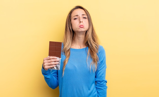 pretty woman with chocolate tablet