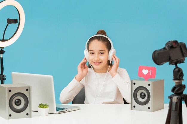 Pretty young girl trying new headphones