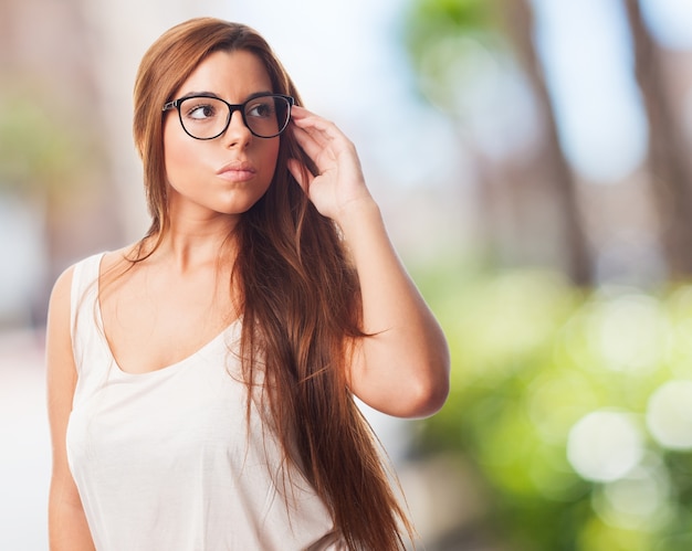 Pretty young girl wearing glasses.