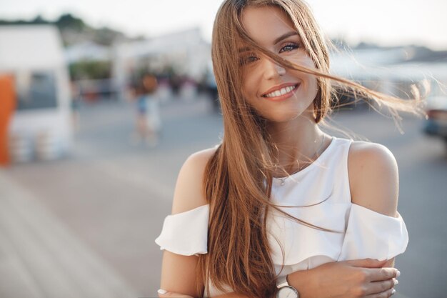 pretty young smiling woman outdoors