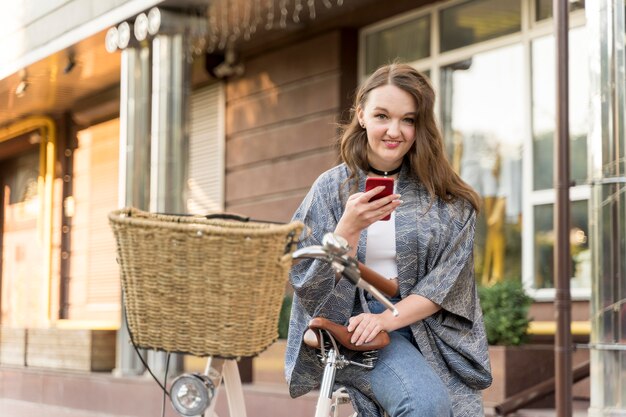 Pretty young woman browsing mobile phone