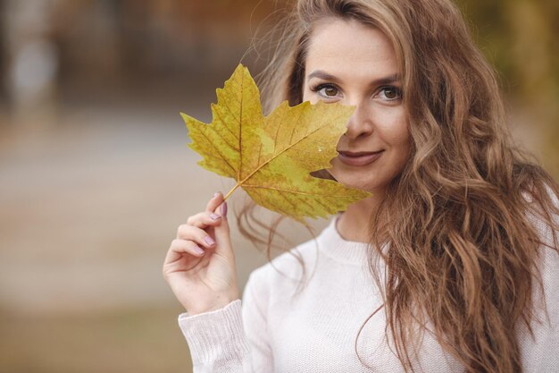 pretty young woman in cozy wear outdoor