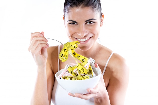 Free photo pretty young woman doing slimming diet. conceptual image about diet