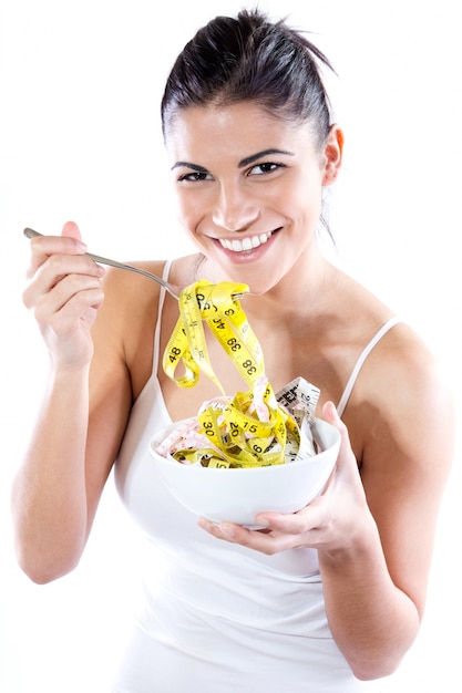 Pretty young woman doing slimming diet. Conceptual image about diet