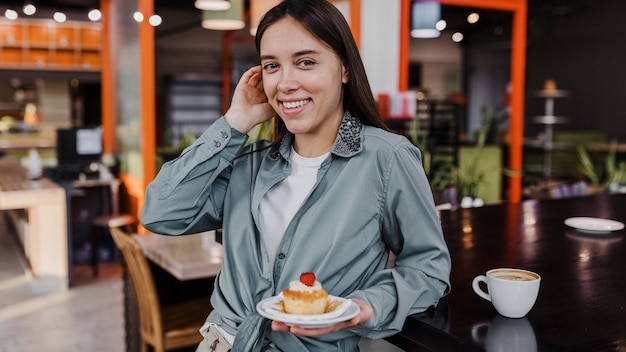 Pretty young woman enjoying a coffee break