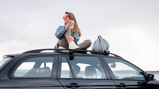 Free Photo pretty young woman enjoying road trip