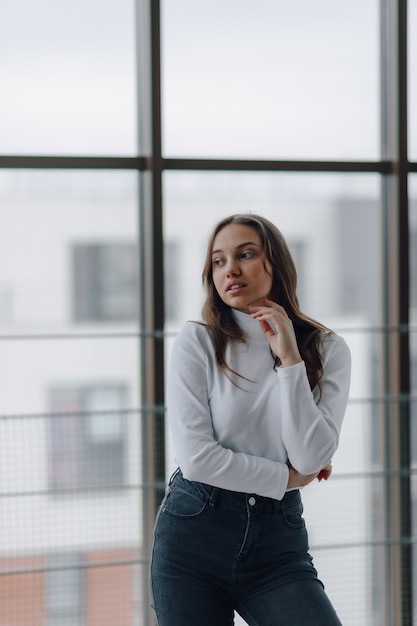 Pretty young woman in a white blouse