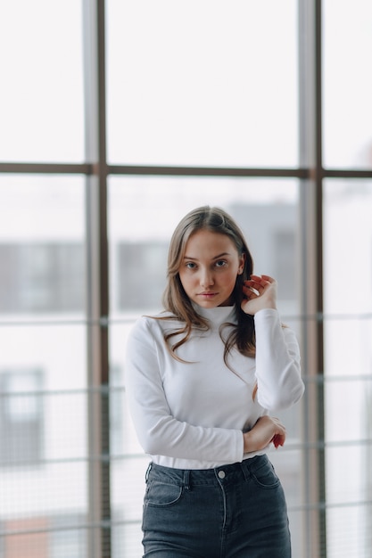 Pretty young woman in a white blouse