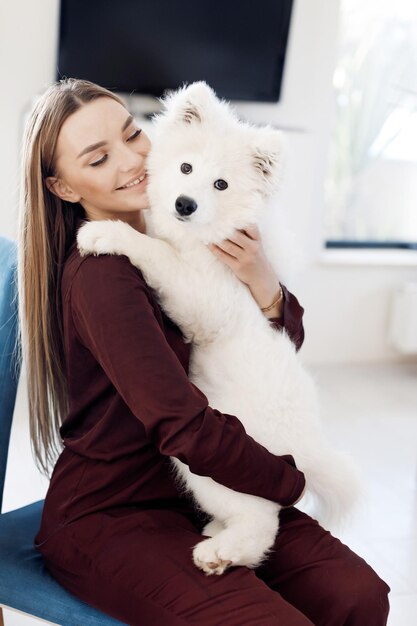 pretty young woman with dog at home