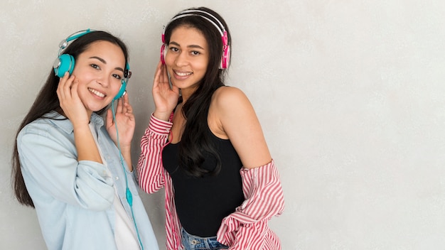 Free Photo pretty young women in headphones