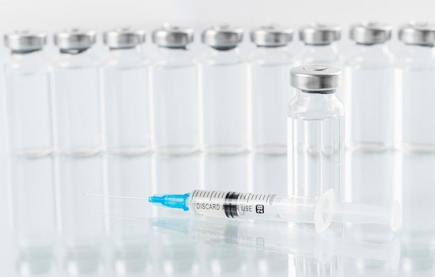 Free photo preventive coronavirus vaccine bottles arrangement