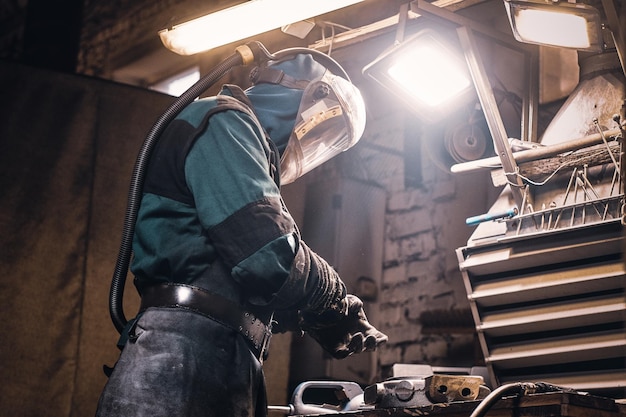 Free photo process of creating new metal parts at busy workshop made by worker.