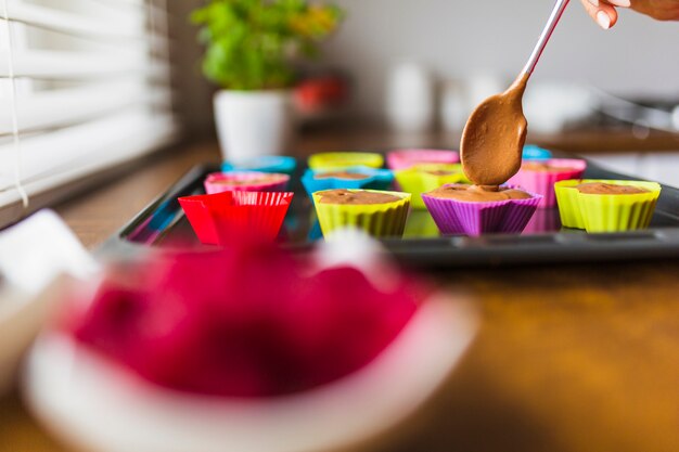 Process of filling baking cups