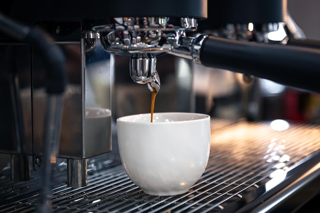 Free photo the process of preparing espresso in a professional coffee machine closeup