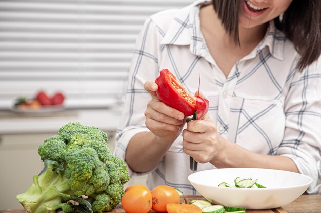 The process of preparing a vegetarian salad. Diet and healthy food concept.