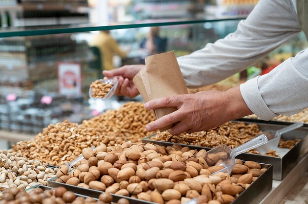 Producer at his shop with different goodies