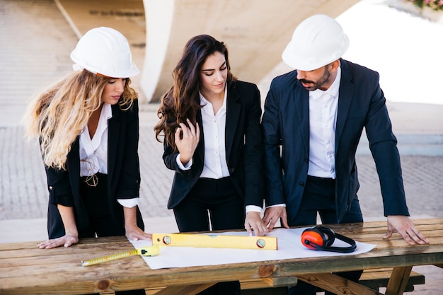 Free photo professional architects looking at plan