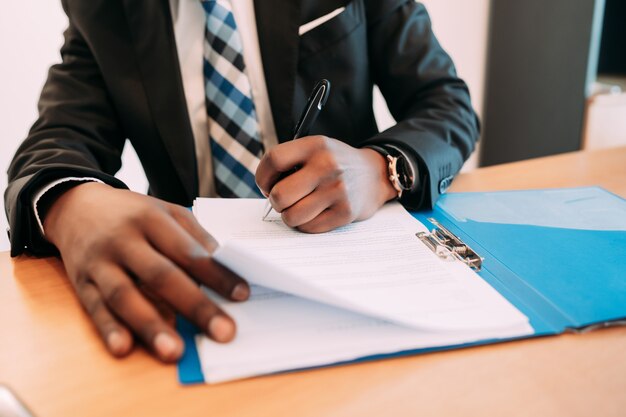 Professional businessman working with documents at his modern office