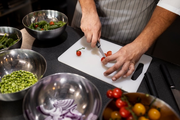 Free Photo professional chef preparing food in the kitchen