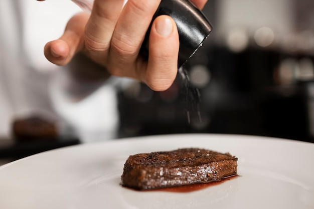 Free Photo professional chef preparing food in the kitchen