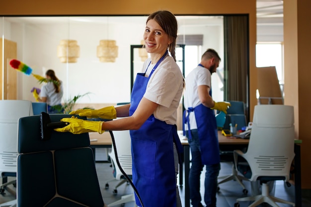 Free photo professional cleaning service people working together in an office