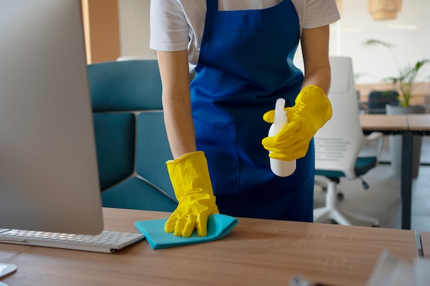 Free photo professional cleaning service person cleaning office