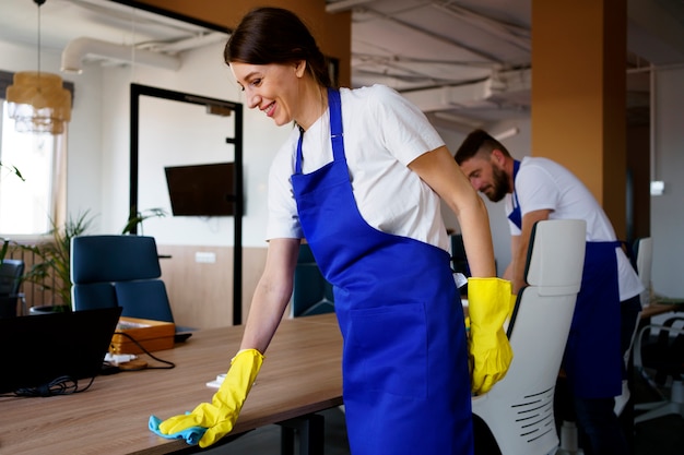 Free Photo professional cleaning service person cleaning office