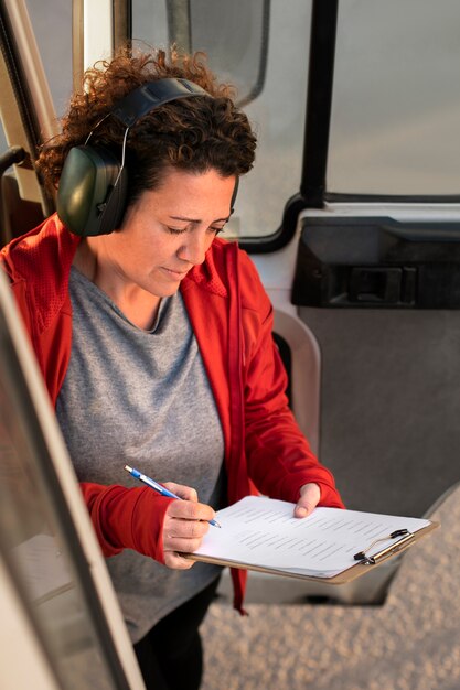 Professional female driver with van or wagon car