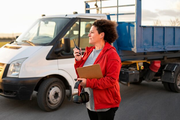 Professional female driver with van or wagon car