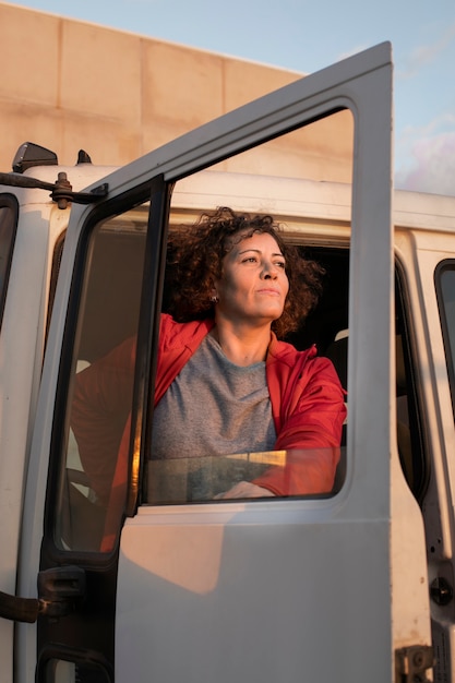 Professional female driver with van or wagon car