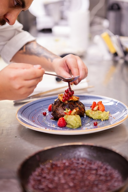 Free photo professional food decoration in restaurant kitchen.cook doing a great job