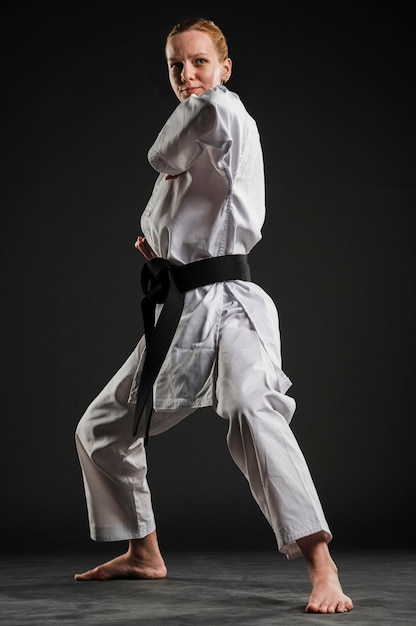 Professional karate woman practicing full shot